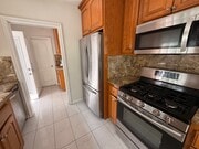Photo - Charming 2 Bed Home with A/C, 2 Car Garage, Huge Yard & In-Unit Laundry