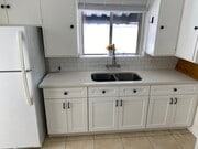 Newly renovated kitchen cabinets and countertops - 11280 Morrison St Apartments