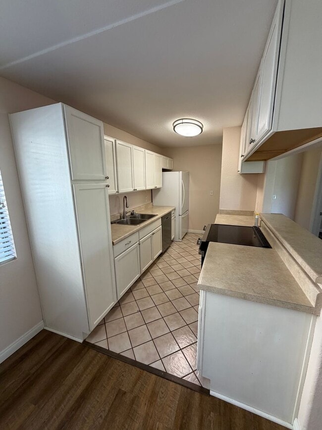 Photo - 2BR/1BA Lakeside ground floor condo with 1 car detached garage, 1 uncovered parking space & commu... Unit A