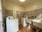 shared laundry room - 10806 Lindbrook Dr Townhome
