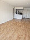 living room and dining room facing kitchen - 1517 E Garfield Ave Condo Unit 48
